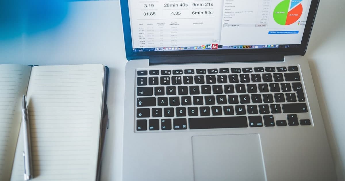 Modern workspace with laptop and notes representing smarter database alternatives to Airtable for teams in 2026