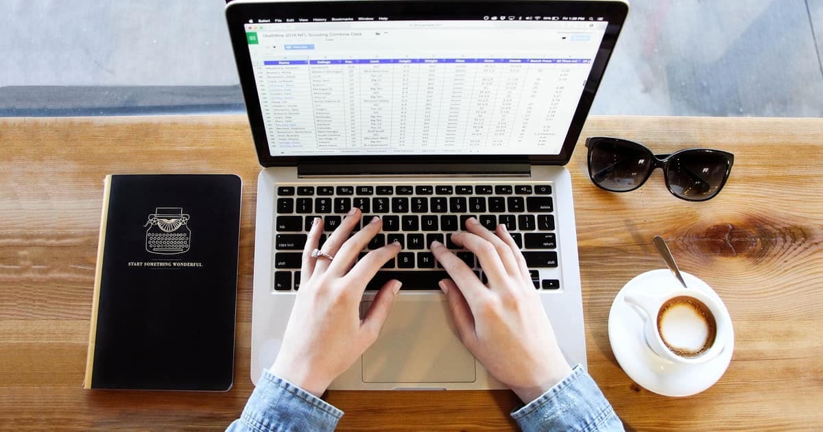 Modern workspace with notebook and laptop representing better Jira alternatives for developer teams in 2026
