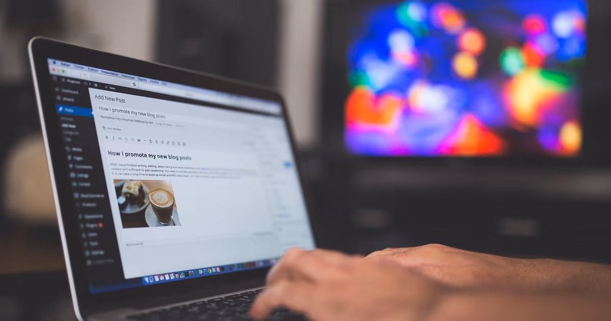 Laptop and notebook representing follow-up email templates for sales and client communication